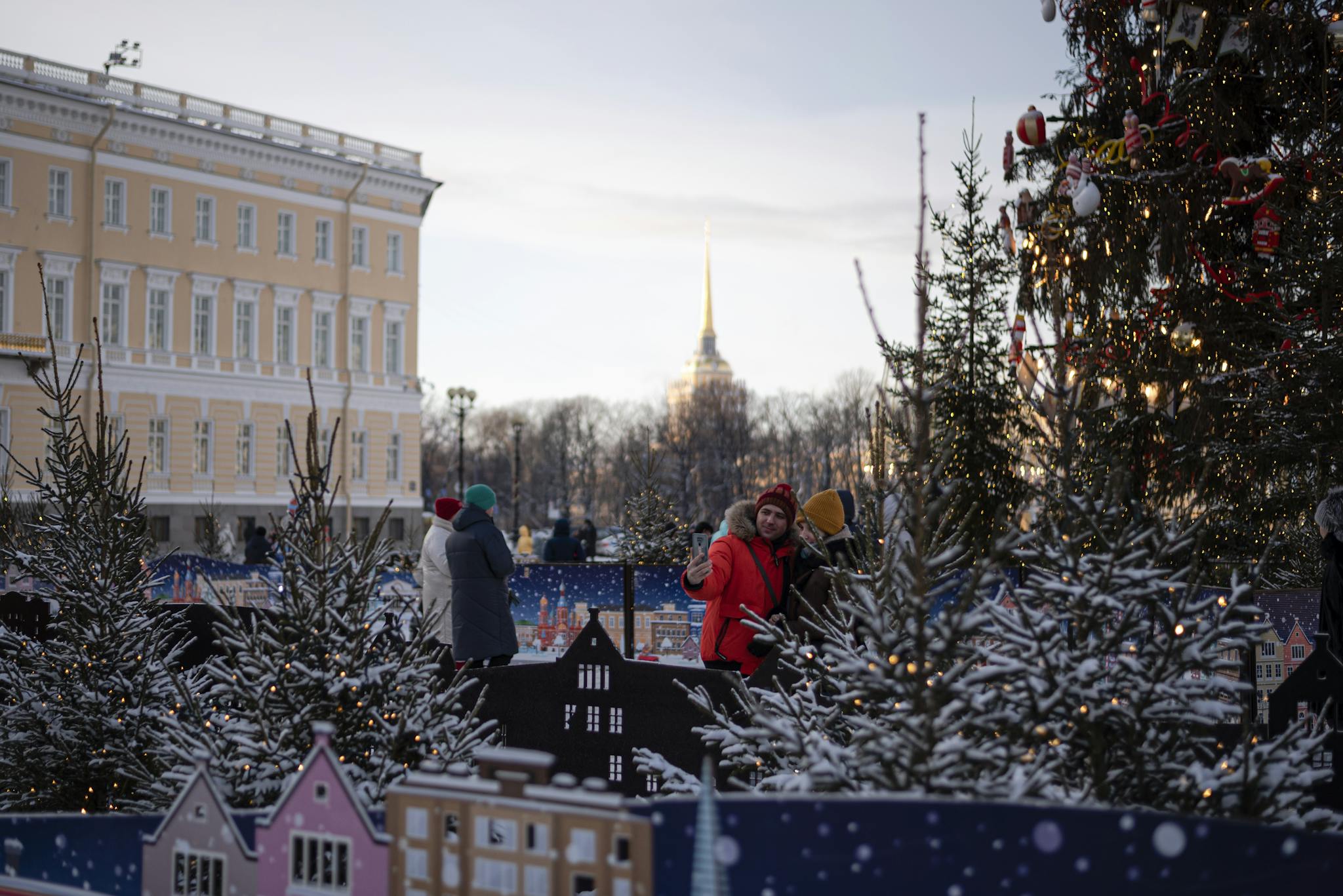 Charming winter market scene with festive decorations and a snowy backdrop. Perfect for holiday themes.